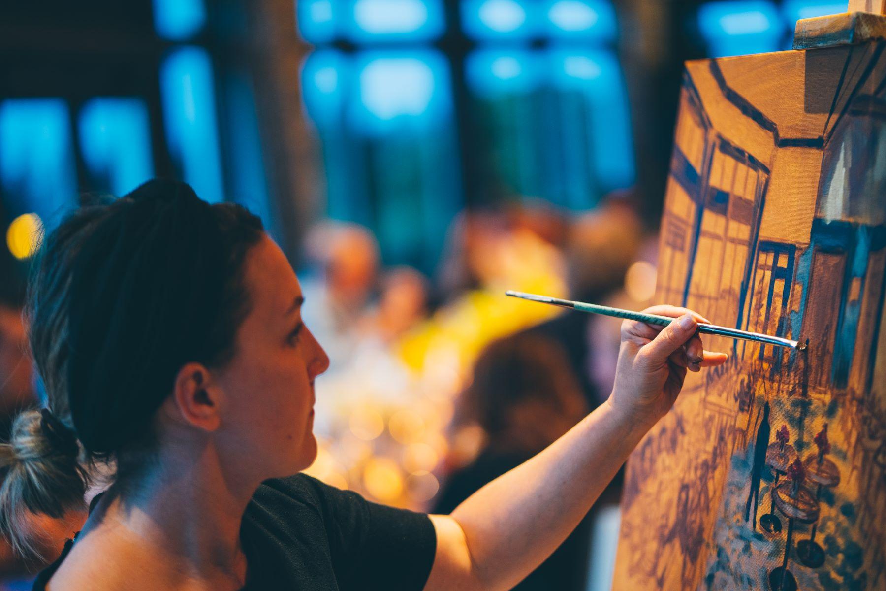 a person enjoying a paint night