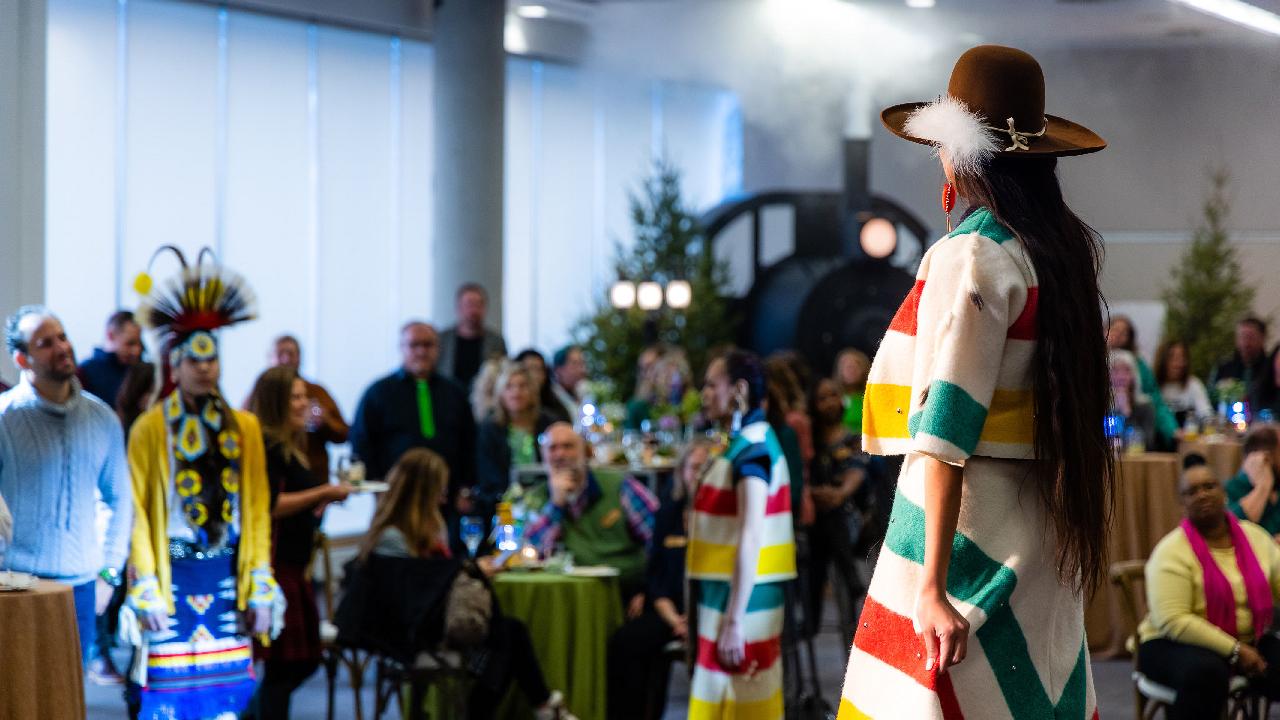 Model posing in modern Indigenous-designed fashion