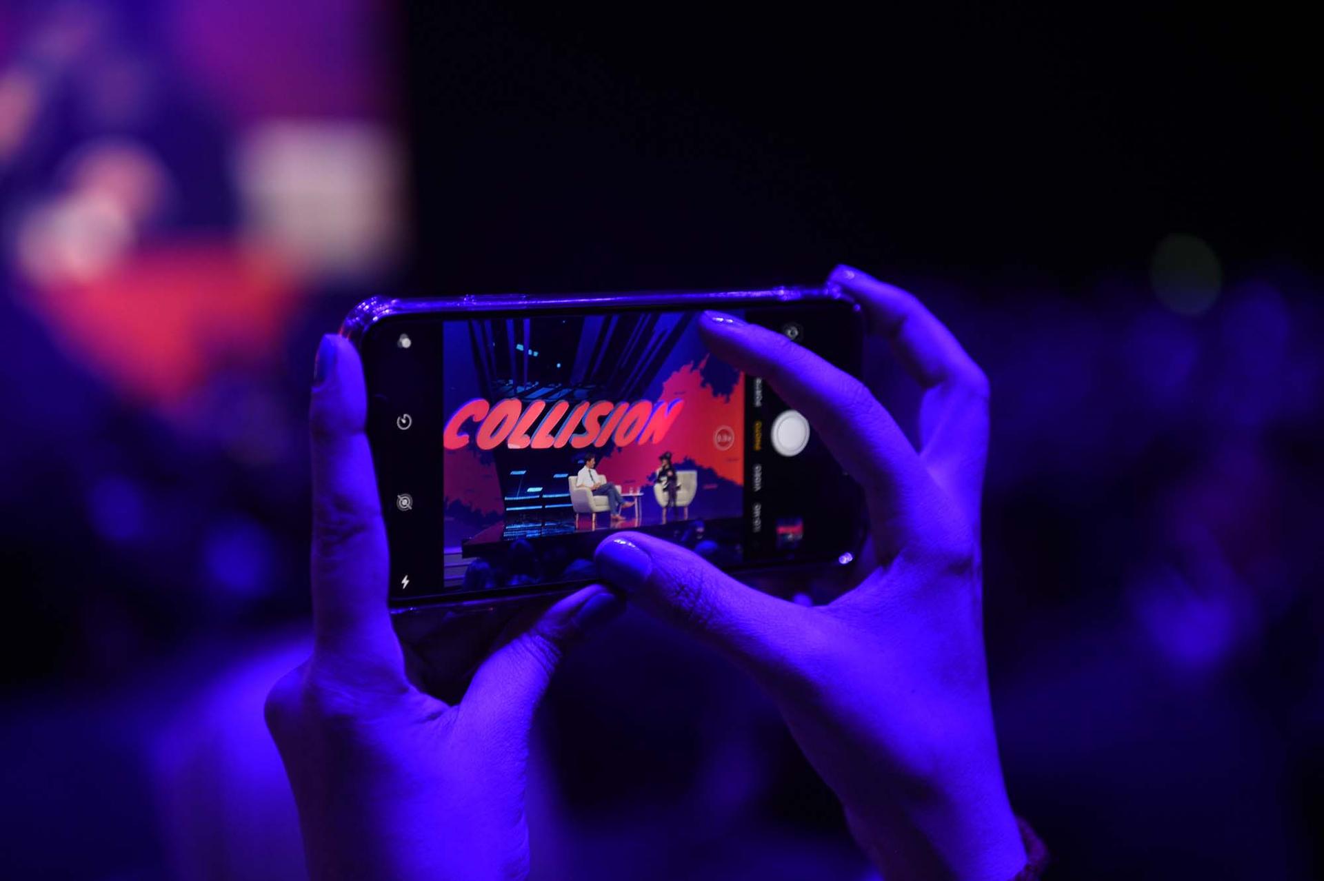 hands holding a phone at collision Conference 2019 in Toronto, Ontario