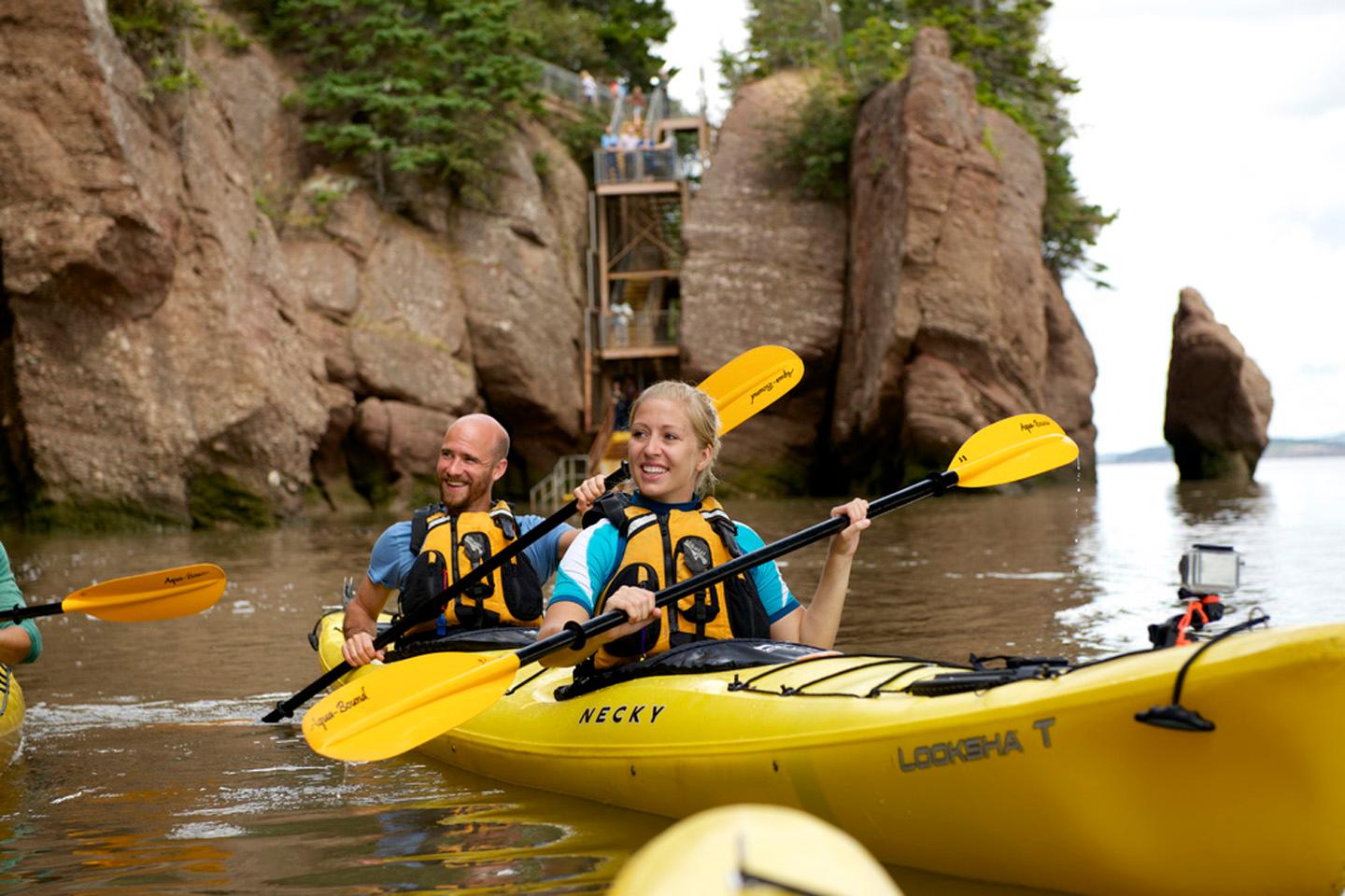Paddle the red rock coastline in tandem kayaks — the longest stretch of coastal wilderness on the eastern shore