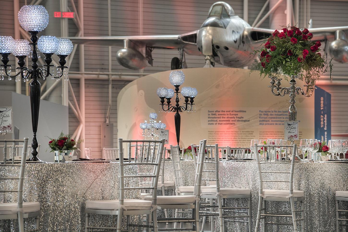 Elegantly appointed cocktail and banquet tables juxtapose aircraft from early to modern age of flight