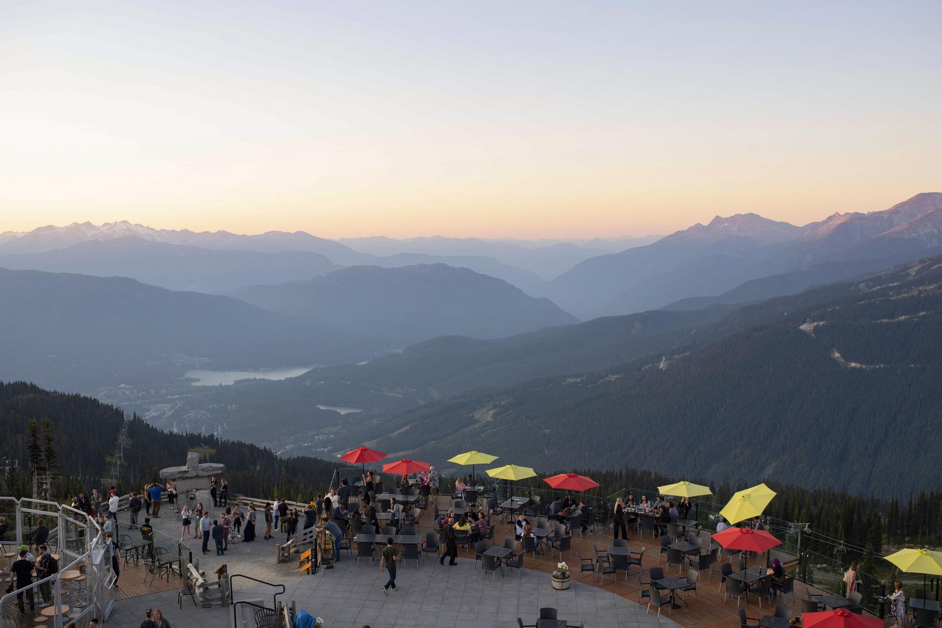 A scenic mountaintop patio at sunset in Whistler, British Columbia